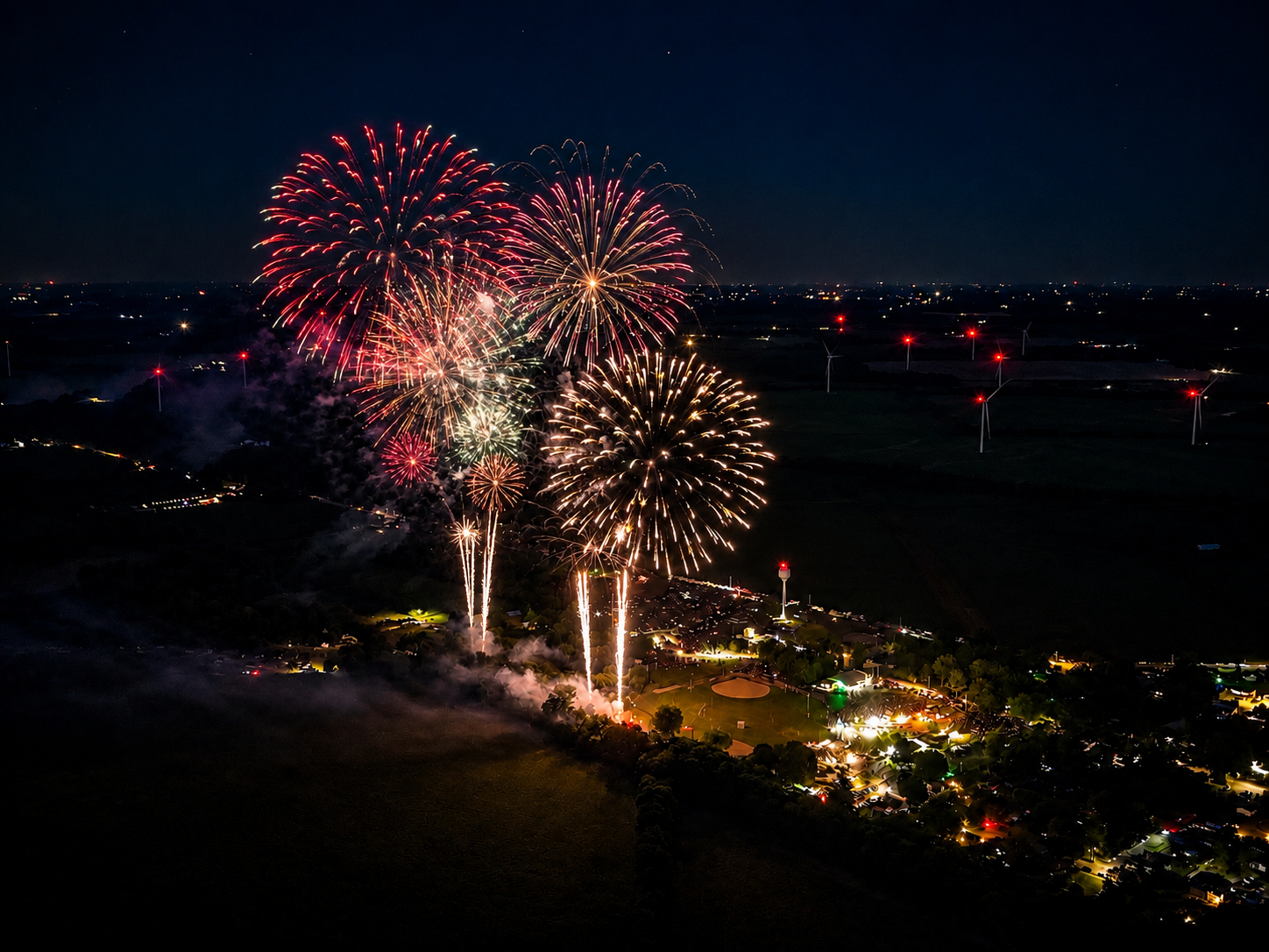 Aerial fireworks display over town