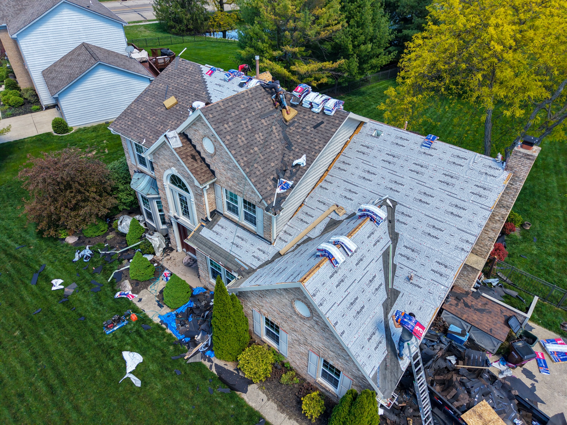 Aerial view of residential roof replacement in progress
